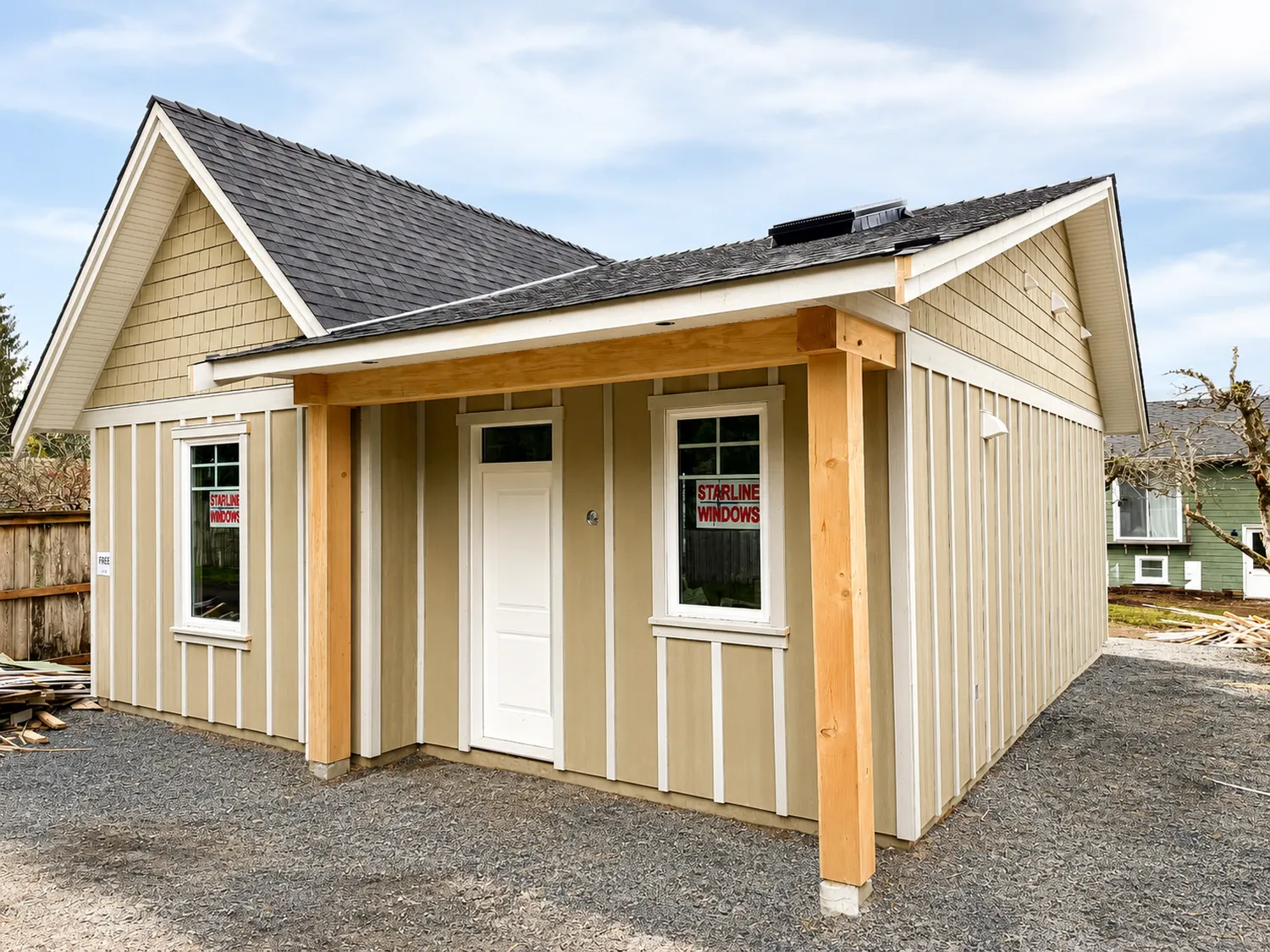 Custom detached garden suite build featuring durable exterior finishes, covered entry detailing, and efficient small-home design.